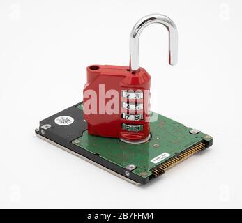 Padlock on top of hard disk drive representing data protection and security Stock Photo