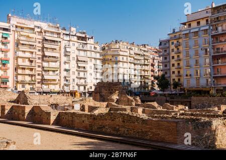 Apartment blocks surround the ancient ruins of Palace of Galerius in Thessaloniki, Greece. Originally built in the 4th century, AD Stock Photo