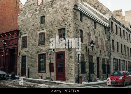 Wide angle of Corner Street, and Old Architectural buildings in the heart of Old Montreal - dec, 2019 Stock Photo