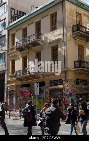 ATHENS, GREECE - 03 Mar 2020 - People crossing a busy thoroughfare in central Athens Greece Stock Photo