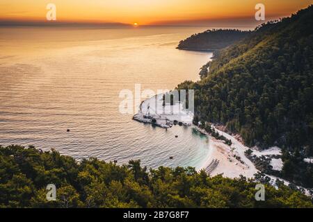 Sunrise over marble beach Porto Vathy in Thassos Island Greece Stock Photo