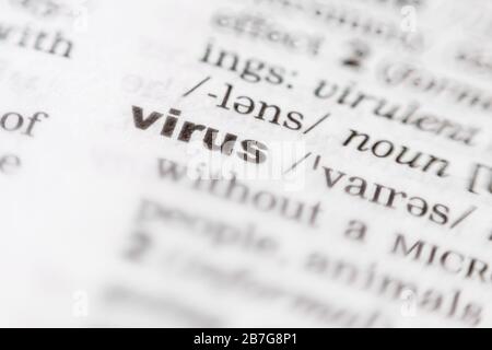 Virus - Focused close up view of a printed word in the dictionary Stock Photo