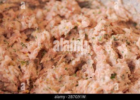 Making bavarian white sausages at home, close up of mixed meat with spices Stock Photo