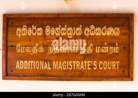 South Asia Sri Lanka Fort Galle colonial town centre old ancient harbour port sign wooden gold lettering three languages Additional Magistrates Court Stock Photo
