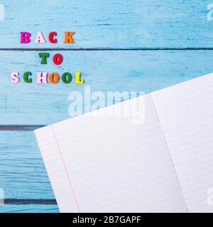 Layout of school supplies on a blue wooden background. The view from the top. Back to school. Flat lay Stock Photo