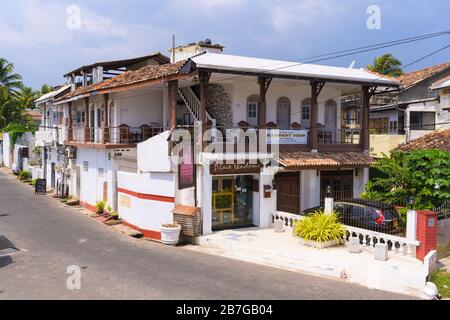 South Asia Sri Lanka Fort Galle colonial town centre old ancient harbour port B&B hotel guest house Place Vendome balcony primitive ramshackled Stock Photo