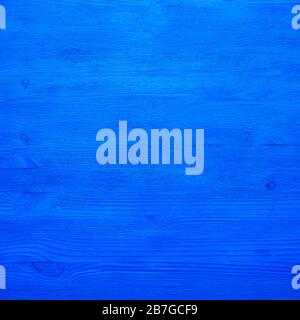 The background is wooden boards, blue saturated color Stock Photo