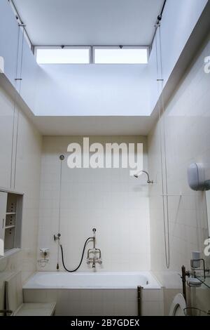 Beautiful shower bath tub in modern functionalism bathroom, white tile design wall Stock Photo