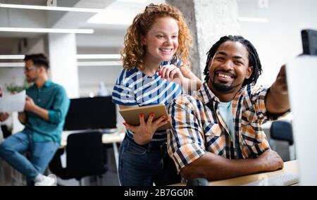 Successful company with happy employees in modern office Stock Photo