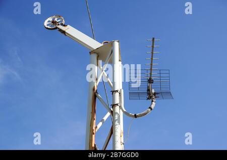 Steel pulley wheel with three steel cables looping around the pulley. Stock Photo