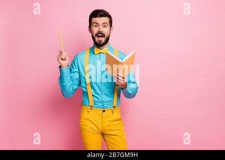 Portrait of his he nice attractive glad excited cheerful cheery bearded guy wearing mint shirt writing creating book thoughts genius solution isolated Stock Photo