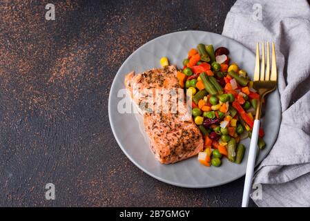 Baked salmon with boiled vegetable Stock Photo