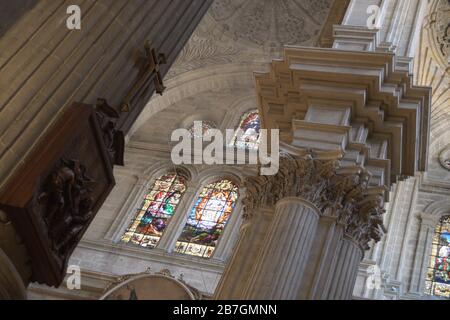 Way of the cross, big pillar and stained glass windows in Malaga Cathedral Stock Photo