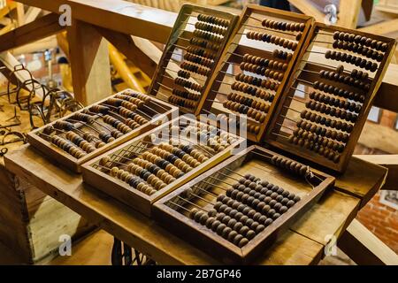 Old vintage wooden abacus on wooden table. Stock Photo