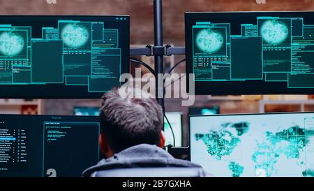 Back view of cyber criminals get access denied while hacking the government. Stock Photo