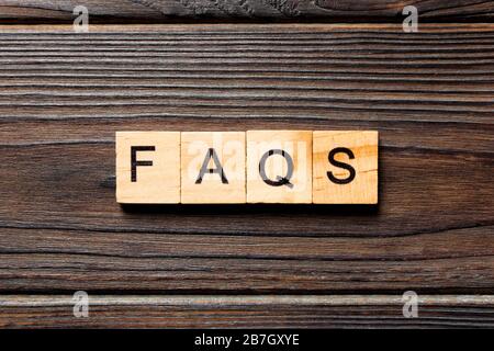 faqs word written on wood block. faqs text on table, concept Stock ...