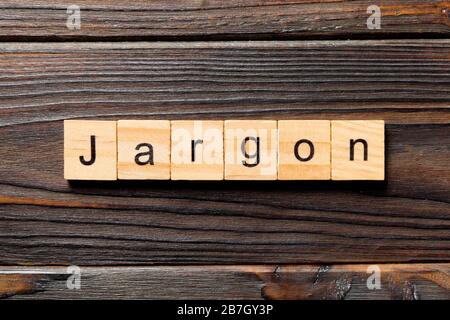 Jargon word written on wood block. Jargon text on wooden table for your desing, Top view concept. Stock Photo