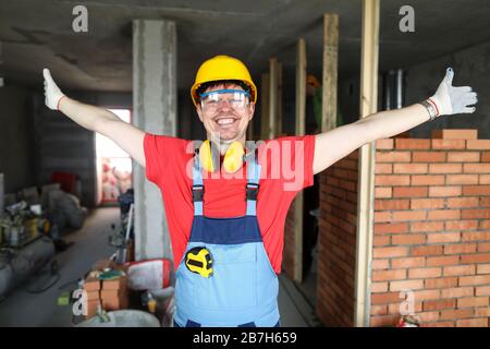 Smiling happy friendly caucasian male showing building area Stock Photo