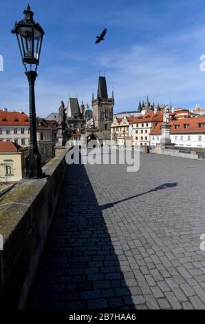 Prague, Czech Republic. 16th Mar, 2020. The Charles Bridge in Prague, Czech Republic, without usual crowds of tourists is seen on March 16, 2020. The government has banned a free movement of people all over the Czech Republic due to the further coronavirus spread as of midnight on March 15 until 6:00, March 24. Credit: Vit Simanek/CTK Photo/Alamy Live News Stock Photo