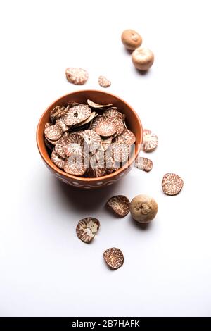 Betel nut chips in a bowl also known as slices of supari in india, used in Paan masala Stock Photo