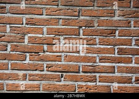 red brick wall with cement grout Stock Photo