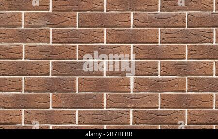 Closeup wall of brown decorative brick. Seamless pattern. Abstract modern brick texture background Stock Photo