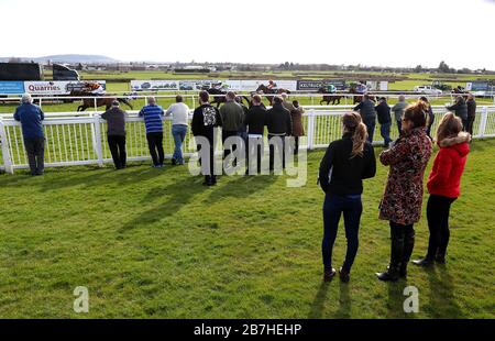 Racegoers watch the Appliance Solutions Ledbury Maiden Hurdle at Hereford Racecourse. Stock Photo