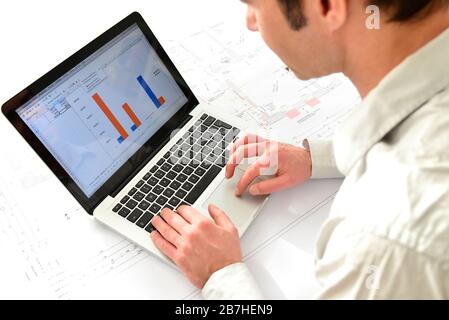 architect at his workplace with notebook - house building and construction in industry Stock Photo
