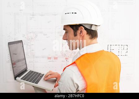 architect at his workplace with notebook - house building and construction in industry Stock Photo