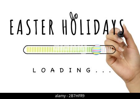 Female hand, writing Easter Holidays doodle with decorative egg loading bar on white background - Spring seasonal holiday coming soon concept poster sign with hand drawn text and cute bunny ears Stock Photo