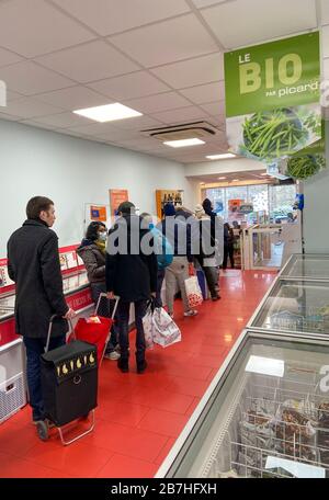 PARISIANS QUEUE FOR FOOD AT SUPERMARKET AFTER CORONAVIRUS OUTBREAK , PARIS  FRANCE Stock Photo