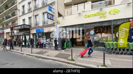 PARISIANS QUEUE FOR FOOD AT SUPERMARKET AFTER CORONAVIRUS OUTBREAK , PARIS  FRANCE Stock Photo