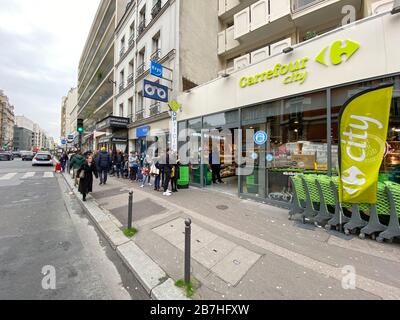 PARISIANS QUEUE FOR FOOD AT SUPERMARKET AFTER CORONAVIRUS OUTBREAK , PARIS  FRANCE Stock Photo