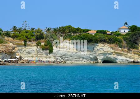 Tourists on Anissaras beach in Crete the largest and most populated of the Greek islands Stock Photo