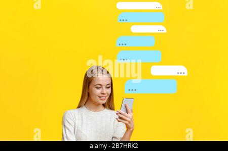 Chatting online. Blonde woman messaging on smartphone against color background, blank space Stock Photo