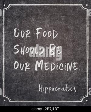 Our food should be our medicine - famous ancient Greek physician Hippocrates quote written on framed chalkboard Stock Photo