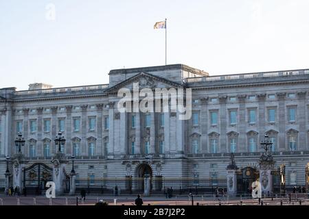 The Royal Standard flies above Buckingham Palace, London, as Queen Elizabeth II returned to central London despite the coronavirus outbreak. Stock Photo