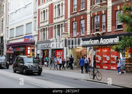 LONDON, UK - JULY 6, 2016: People shop at Oxford Street in London. Oxford Street has approximately half a million daily visitors and 320 stores. Stock Photo