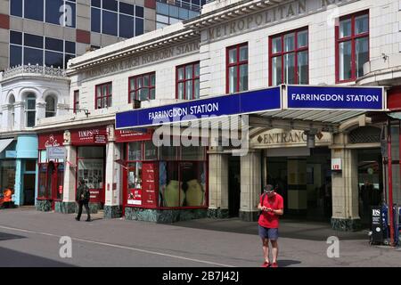 LONDON, UK - JULY 9, 2016: People walk by Farringdon Station in London. London Underground annual entry and exit for Farrington Station amounted to 15 Stock Photo