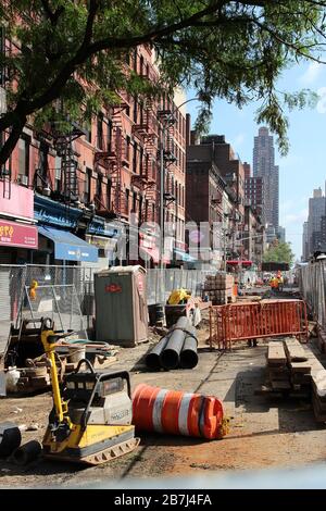 NEW YORK, USA - JULY 5, 2013: Workers perform construction works in 9th Avenue, New York. Almost 19 million people live in New York City metropolitan Stock Photo