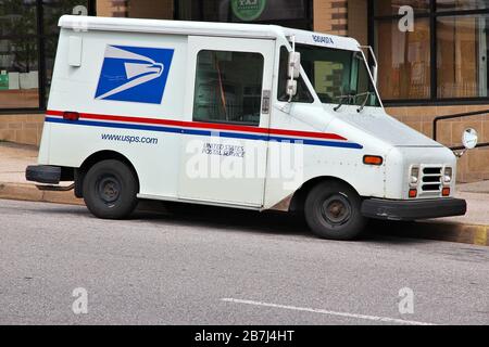 USPS van Postman and delivery van USA American postman and his red ...