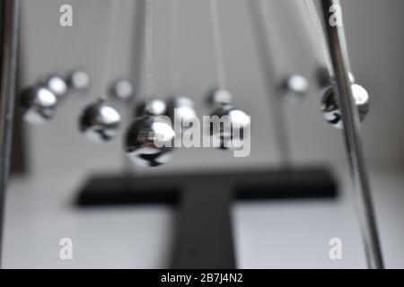 Business concept for strategy team work and alignment. Newtons Cradle Pendulum. Stock Photo