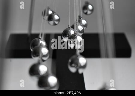 Business concept for strategy team work and alignment. Newtons Cradle Pendulum. Stock Photo