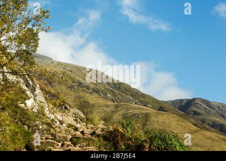 The lower stages of the tourist route up Ben Nevis on the rough track crossing the slopes of Meall an t-Suidhe, Fort William, Scotland Stock Photo