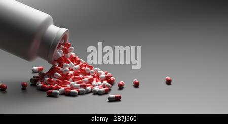 Capsule medicine pills, health pharmacy concept. Drugs for treatment medication. Red white color capsules scattered out of a bottle on gray background Stock Photo