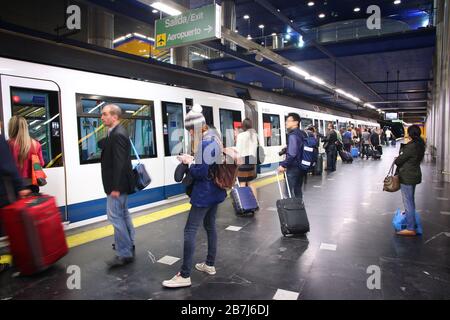 MADRID, SPAIN - OCTOBER 21, 2012: People wait for train at Madrid Metro. Madrid Metro has annual ridership of 634 million passengers (2011). Stock Photo