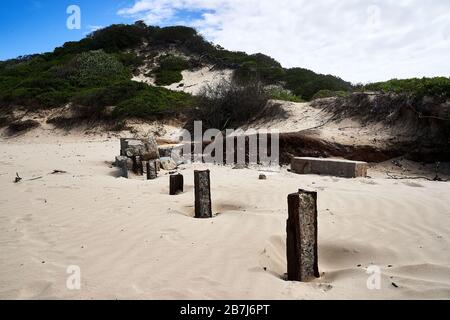 Dunes and old Concrete Blocks at sunny Nahoon Beach Stock Photo