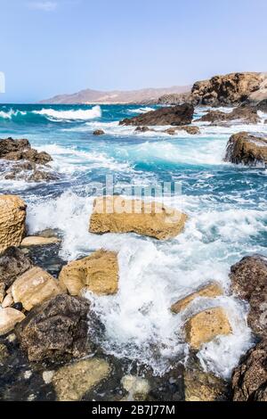 Heavy Atlantic waves breaking on rocks on the beach at La Pared on the west coast of the Canary Island of Fuerteventura