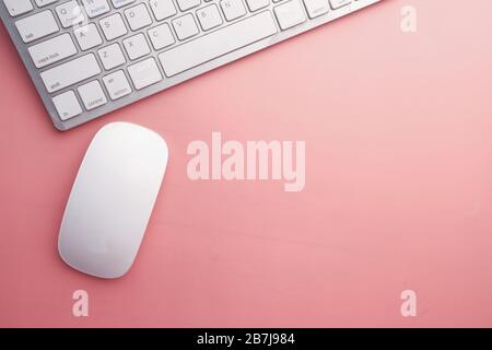 computer mouse and keyboard on pink background  Stock Photo