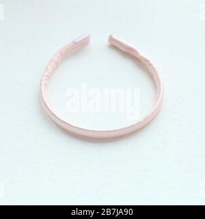 pink silk hair hoop. Flat lay Hairdressing tools and accessories as Color Hair Scrunchies, Orbital Hair ring or Stock Photo